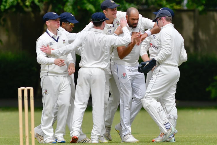 Alton bowler Bash Walters is congratulated after taking a wicket (Photo: Martyn White)