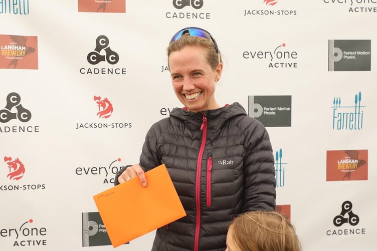 Christina Jenkins receives her second place award at the Cocking 10km