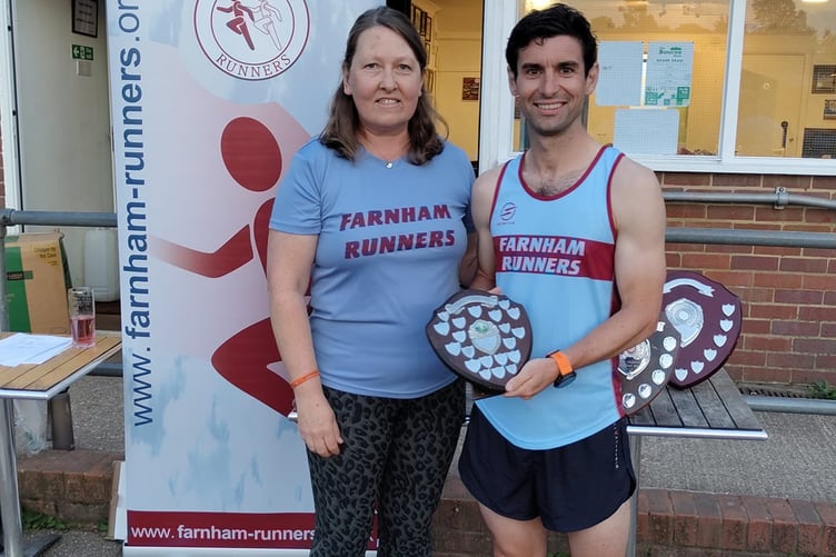 Overall winner and first senior man Joe Collins receives his trophy from Nicola O'Connor