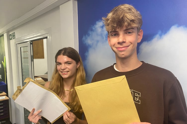 Ben and Claudia happy with their results at Weydon School