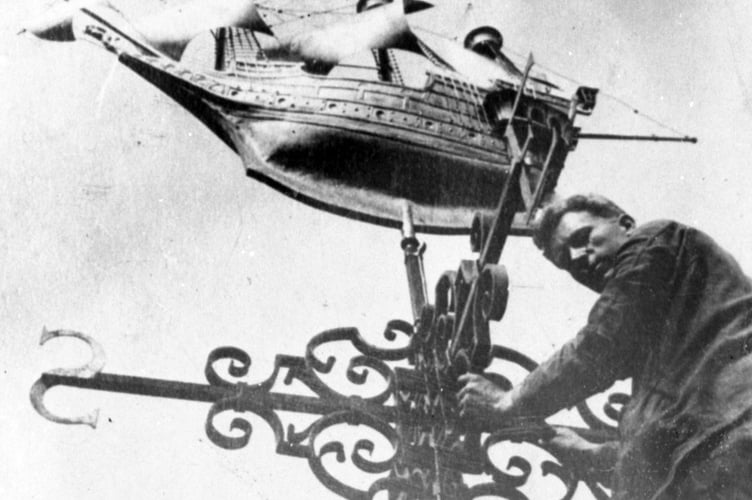 Positioning the weather vane on top of the 1930s Town Hall Buildings in Castle Street, Farnham - but what is the ship?