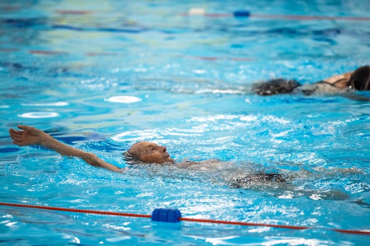 Everyone Active member swimming 
