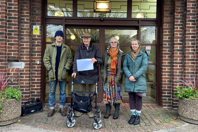 Left to right, Archie, David Petche, Anna Grey and Julie Yardley with the petition outside the town council building