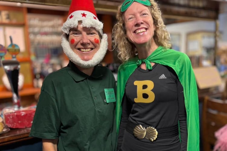 Fancy dress winner Lindsay Bamford as Norbot pictured with Becky Martin as super hero Bionic Becky