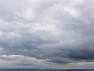 Overcast morning with patchy rain clearing to sunshine
