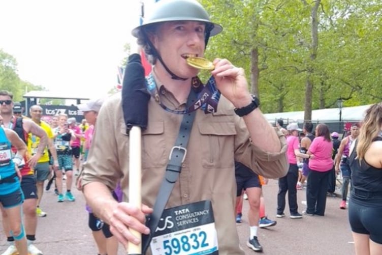 Seadhna with his medal at the London Marathon finish line.