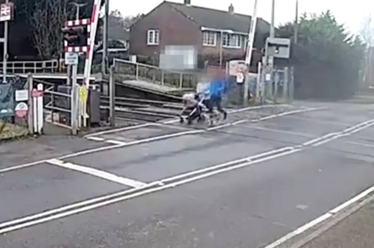 **Embargoed until 00.01 GMT / Wednesday 30 April 2025**
Pram-pushing couple failing to observe safety barrier alarms. Shocking CCTV footage captures the danger of pedestrian distractions at level crossings. Release date - April 29, 2025. The montage footage highlights the potential risks of losing focus near a railway line, from a teenager stood in the middle of a level crossing gazing at their mobile phone, to a pram-pushing couple failing to observe safety barrier alarms. In a world full of distractions, Network Rail is warning of the more serious consequences of being distracted at level crossings. Over the past four years**, there have been 1,574 recorded near miss incidents involving pedestrians at level crossings. Over that same period, incidents have increased on average by 16% from April to May.