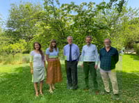 MP Damian Hinds makes friends with moths at Chawton travel agents