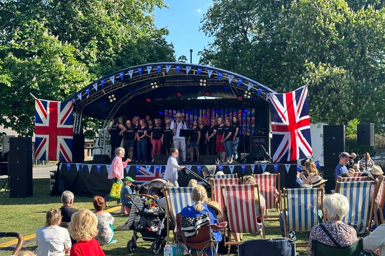 A Spitfire flypast, live music and stories from the war marked Haslemere’s VE Day celebration on Lion Green