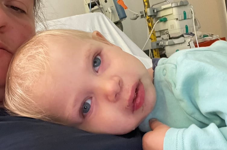 Felix Disney-Moore with mum Hayley in hospital. The parents of a little boy diagnosed with two rare cancers before the age of three were "relieved" to discovered he had blood cancer instead of the disease in his eye spreading - because it gave him "a chance of survival". Felix Disney-Moore, four, had no symptoms until his mum, Hayley Disney, 40, spotted a white glow left eye and took him for a check-up at Frimley Park Hospital, Surrey. He was urgently referred to Royal London Hospital and diagnosed with bilateral retinoblastoma - a form of eye cancer that affects both eyes - and the family were told he'd need his left eye removed to save his life.