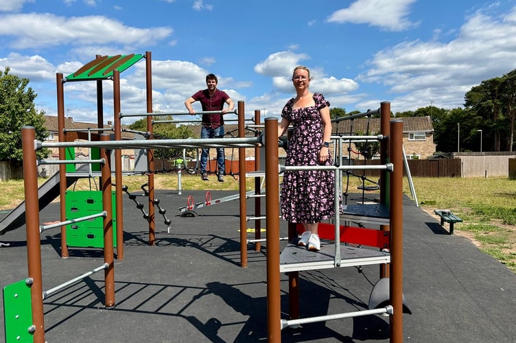 Cllr Andy Tree, EHDC deputy leader and portfolio holder for the Whitehill and Bordon Area, and Cllr Catherine Clark, ward councillor, with new play equipment at Hollybrook Recreation Park.