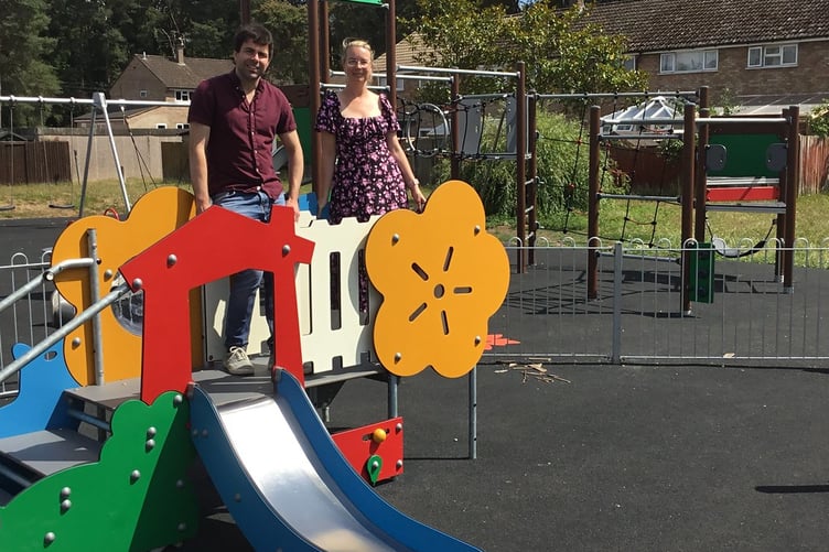 Cllr Andy Tree, EHDC deputy leader and portfolio holder for the Whitehill and Bordon Area, and Cllr Catherine Clark, ward councillor, with new play equipment at Hollybrook Recreation Park.