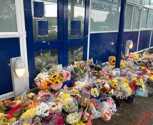 Flowers laid outside school as two students die on same day