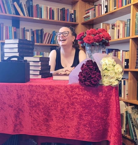 Freedom Matthews signs limited edition copies of Scarlett Redemption at Haslemere Bookshop during the book launch