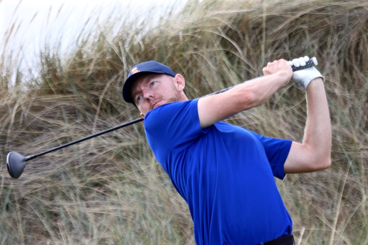 Liphook's George Saunders tees off at the tenth playing against Surrey in the South East League at Hayling Golf Club (Photo: Andrew Griffin/AMG PICTURES)