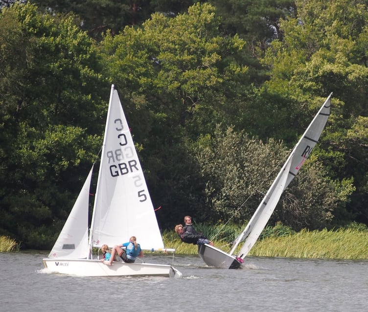 Making waves for charity: Sailors take on the 10-hour challenge at Frensham Pond to support MND research