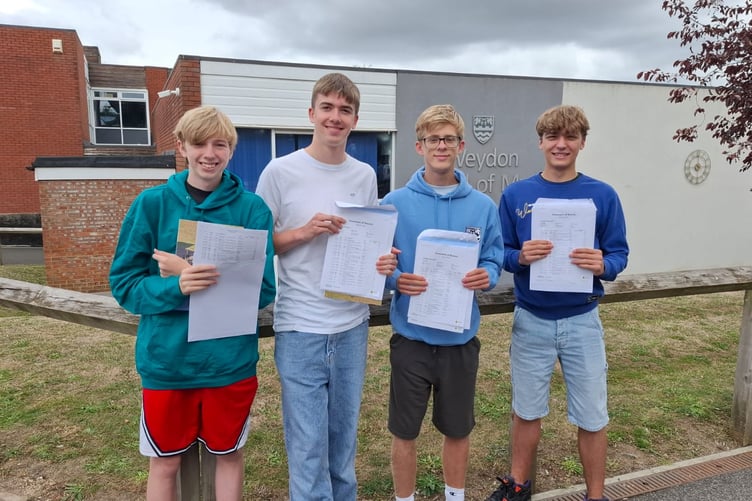 George Harris, Tom Wrightman, Thomas Gwilliam and Joshua Bullock celebrate GCSE day at Weydon School in Farnham.