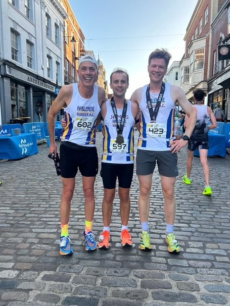 Daniel Allaway, James Turner and Duncan Selmes having completed the Guildford 10km race