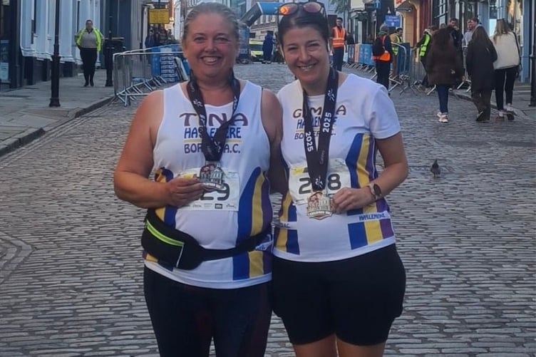 Tina Fairminer and Gemma Reeder celebrate their success in the Guildford 10km race