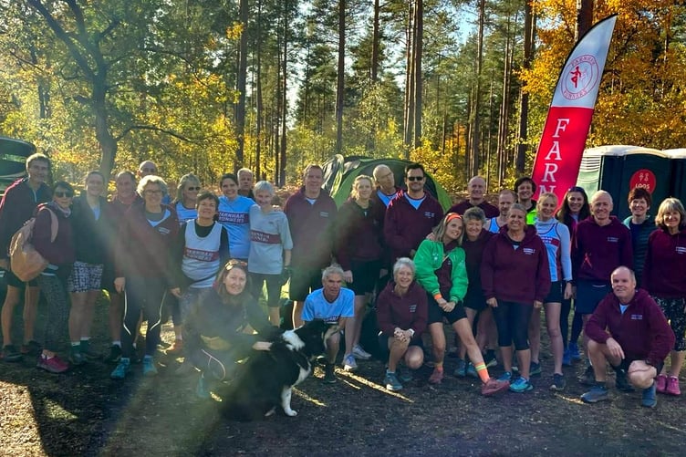 Farnham Runners line up for a team photo at the opening cross country fixture of the season