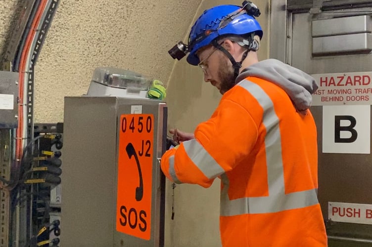 Checking SOS phones Hindhead Tunnel