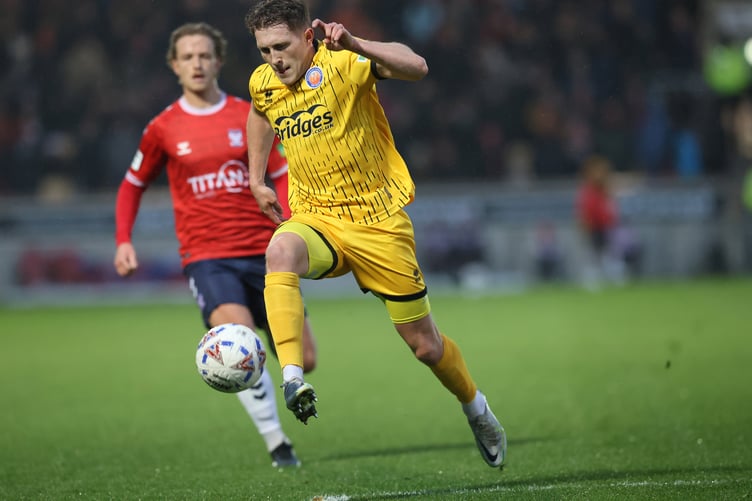 Cameron Hargreaves drives forward for Aldershot Town during their 5-1 defeat at York City (Photo: Ian Morsman)