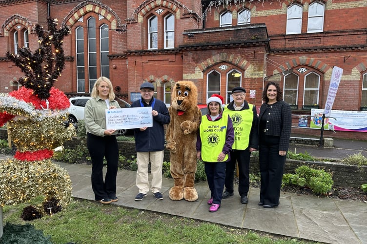 Rhian Strothers and Amina Kellie from PelGar International hand over a donation to Alton Lions Club outside the Alton Assembly Rooms, December 4th 2025.