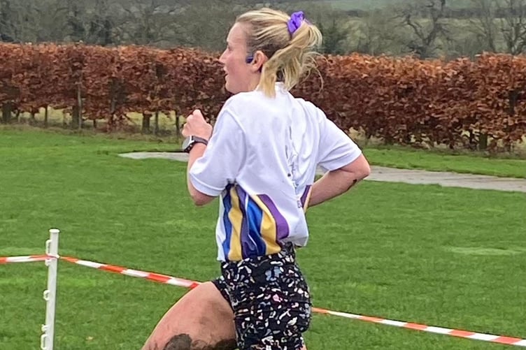 Katie Simmonds powers to the finish line at the Lord Wandsworth cross country