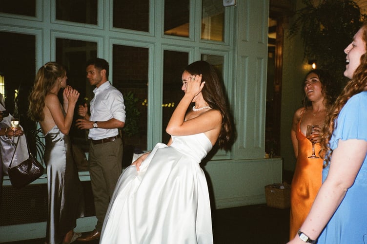 Teresa Boardman, on her wedding day. // A bride who loves the rush of a getting a good deal has bought four wedding dresses for her nuptials, all for under £1k. Teresa Boardman, 24, snagged four wedding dresses for a total of £850 by shopping on second hand clothing apps and scouring the sales. Teresa and her husband, Jamie Ellis, 26, gat married earlier this year in a Hampshire hotel and also plan to have a second wedding in the Philippines next May to include Teresa's extended family. The fashion-conscious bride decided to wear four dresses across these two events- three at her English wedding and another for the Philippines.