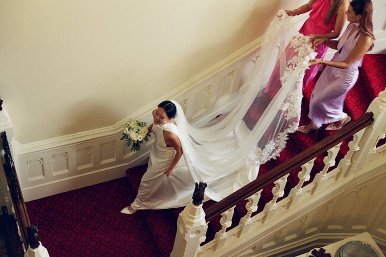 Teresa Boardman, on her wedding day. // A bride who loves the rush of a getting a good deal has bought four wedding dresses for her nuptials, all for under £1k. Teresa Boardman, 24, snagged four wedding dresses for a total of £850 by shopping on second hand clothing apps and scouring the sales. Teresa and her husband, Jamie Ellis, 26, gat married earlier this year in a Hampshire hotel and also plan to have a second wedding in the Philippines next May to include Teresa's extended family. The fashion-conscious bride decided to wear four dresses across these two events- three at her English wedding and another for the Philippines.