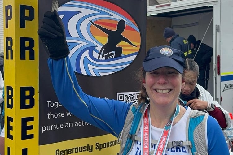 Rachel Lane rings the personal best bell in Delaware