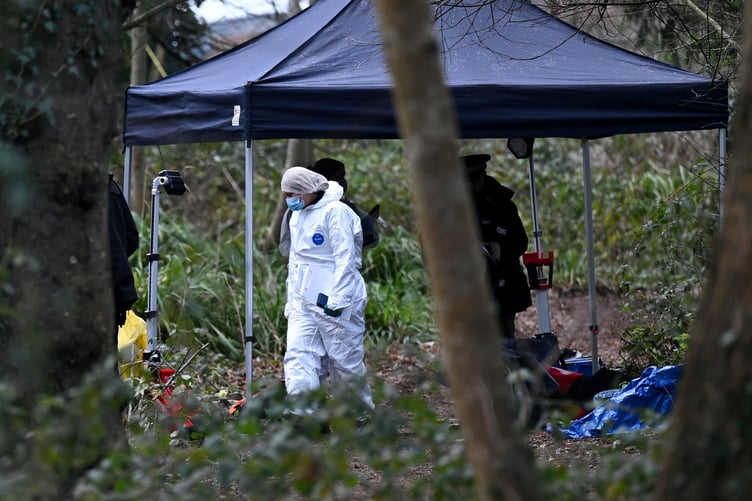Police forensics at the scene of a murder investigation that has been launched following the death of a teenage boy in Guildford, Surrey, 20th January 2026 // A murder probe has been launched following the death of a teenage boy in Guildford. Emergency services were called to reports of a stabbing in woodland off Lido Road in Stoke Park - near to Guildford College - at around 6:10pm last night (Mon). Despite their best efforts a teenage boy died at the scene, Surrey Police said. An investigation is now underway. No arrests have been made.