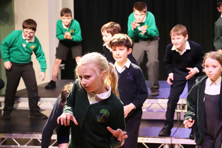Year 5 pupils from Highfield and Brookham join friends from Beacon Hill and Easebourne Primary to rehearse songs and dance moves.