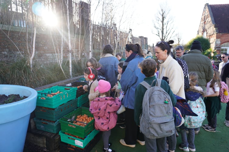 Parents and children at a FareShare Sussex & Surrey school pantry.