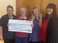 Care in the community as £3,500 handed to dementia charity