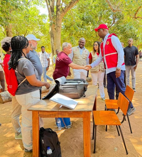 Vodafone Foundation volunteer Dave Harrington, from Alton, shakes hands with Daniel Chapo, the president of Mozambique, February 6th 2026.