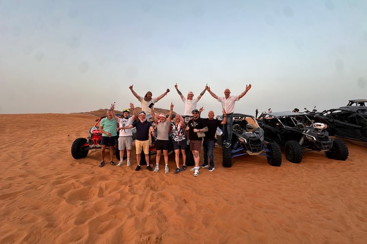 Chris Day and his friends on the stag do while dune buggying in Dubai's deserts.