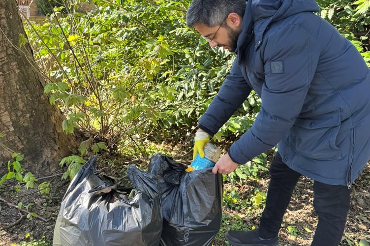 Cllr Adeel Shah cleaning up on Station Road