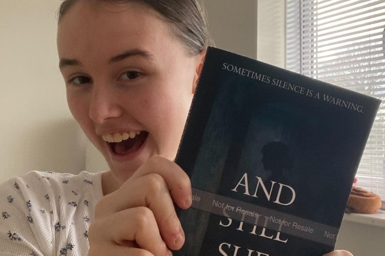 Liss resident Chloe Ramsay with her book And Still She Stayed.