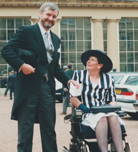 Sue Williams with her husband Glynn at Buckingham Palace in 1994 to receive her MBE.