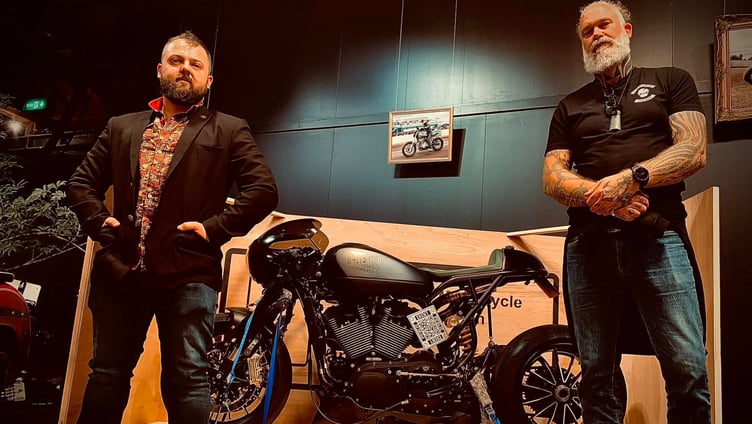 Dom Barker and Mason Haynes with one of their custom bikes.